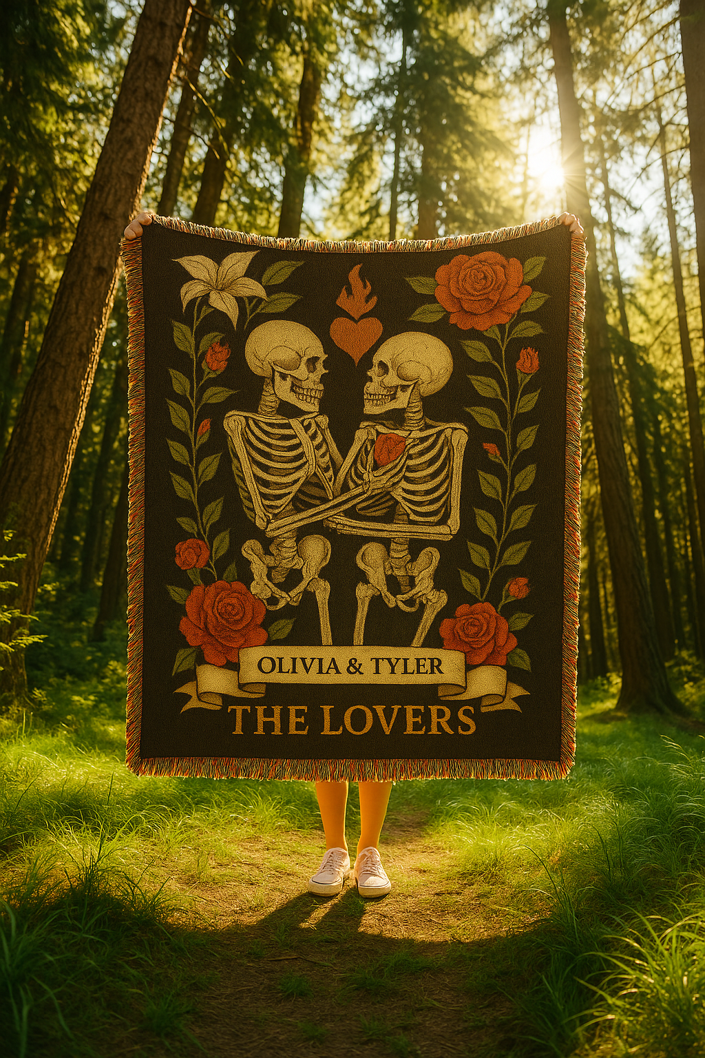 Person holding a blanket with skeletons and roses design in a forest